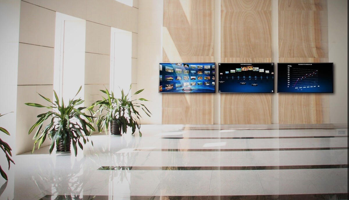 room of building with panel of TVs